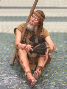 Beggar infected with one of the bacterial rat-borne diseases